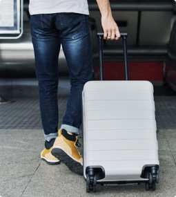 man carrying a suitcase